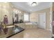 Luxurious bathroom with granite countertop, cabinets, and tile flooring at 10540 Byrum Woods Dr, Raleigh, NC 27613