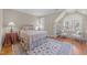 Bedroom showcasing plush bed, natural light, rug and seating at 10540 Byrum Woods Dr, Raleigh, NC 27613