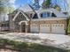 Spacious home with a three-car garage and a beautifully paved driveway at 10540 Byrum Woods Dr, Raleigh, NC 27613