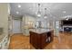 Gourmet kitchen with granite countertops, dual islands, and stainless steel appliances at 10540 Byrum Woods Dr, Raleigh, NC 27613