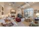 Cozy living room with coffered ceilings, large windows, and stylish decor at 10540 Byrum Woods Dr, Raleigh, NC 27613