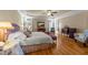 Spacious main bedroom featuring hardwood floors, sitting area, and natural lighting at 10540 Byrum Woods Dr, Raleigh, NC 27613
