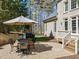 Outdoor patio with dining area and grill, perfect for entertaining at 10540 Byrum Woods Dr, Raleigh, NC 27613