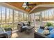 Inviting screened porch with comfortable seating and views of the wooded outdoors at 10540 Byrum Woods Dr, Raleigh, NC 27613