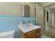 Bathroom featuring blue tile and a sink with cabinet at 1101 Nashville Rd, Rocky Mount, NC 27803