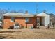 Red brick home with a gray roof and white trim at 1101 Nashville Rd, Rocky Mount, NC 27803