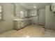 Functional kitchen with vintage cabinetry, laminate countertops, and ample potential at 1101 Nashville Rd, Rocky Mount, NC 27803