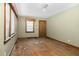 Sun-drenched living room with hardwood flooring, vintage trim, and ample natural light at 1101 Nashville Rd, Rocky Mount, NC 27803