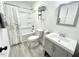 Updated bathroom with gray vanity, shower and tub, and modern fixtures at 112 Wichita Way, Louisburg, NC 27549
