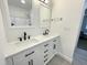 A full bathroom with a double sink vanity, marble countertop, wood-look flooring, and a shower at 112 Wichita Way, Louisburg, NC 27549