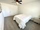 Bedroom featuring neutral carpet, white walls, with white doors, and a ceiling fan at 112 Wichita Way, Louisburg, NC 27549