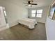 Neutral bedroom features a ceiling fan and double windows for plenty of natural light at 112 Wichita Way, Louisburg, NC 27549