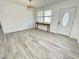 The open concept living room offers neutral plank flooring and is freshly painted at 112 Wichita Way, Louisburg, NC 27549