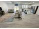 Bright, open-concept living room flows into a kitchen with stainless appliances and a center island at 112 Wichita Way, Louisburg, NC 27549