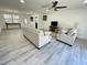 The open living room has ample natural light and flows seamlessly into the dining area at 112 Wichita Way, Louisburg, NC 27549