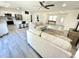 The expansive open-concept living room features plank flooring and a view of the kitchen and dining area at 112 Wichita Way, Louisburg, NC 27549