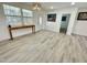 Bright and airy living room features wood floors and offers seamless access to other living spaces at 112 Wichita Way, Louisburg, NC 27549