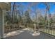 Spacious back deck features a wooden railing and natural view at 114 Twin Springs Ln, Angier, NC 27501