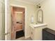 This bathroom features a vanity with decorative mirror and neutral wall color at 114 Twin Springs Ln, Angier, NC 27501
