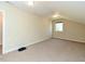 This bedroom features neutral walls and carpet flooring with good natural lighting at 114 Twin Springs Ln, Angier, NC 27501