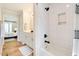 Well-lit bathroom with a shower and separate vanity at 1301 Flying Hawk Rd, Apex, NC 27523