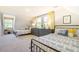 Large bedroom featuring matching twin beds, a dresser, and bright yellow accents at 1301 Flying Hawk Rd, Apex, NC 27523