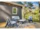 Relaxing deck space with outdoor seating and overhead string lights at 1301 Flying Hawk Rd, Apex, NC 27523