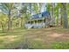 Charming exterior view of home featuring a welcoming front porch and well-maintained lawn at 1301 Flying Hawk Rd, Apex, NC 27523