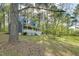 Charming home nestled among trees, featuring a welcoming front porch at 1301 Flying Hawk Rd, Apex, NC 27523