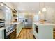 Bright kitchen with stainless appliances, kitchen island, and a white subway tile backsplash at 1301 Flying Hawk Rd, Apex, NC 27523