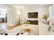 Relaxing living room with modern decor and ample natural light at 1301 Flying Hawk Rd, Apex, NC 27523