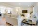 Open-concept living room with view to kitchen at 1301 Flying Hawk Rd, Apex, NC 27523