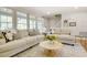Comfortable living room with large windows and decorative accents at 1301 Flying Hawk Rd, Apex, NC 27523