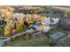 Sprawling estate with a tennis court, lush landscaping, and a serene pond surrounded by trees at 1404 Barony Lake Way, Raleigh, NC 27614