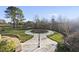 Beautiful backyard features manicured landscaping, stone paths, and mature trees for serene outdoor living at 1404 Barony Lake Way, Raleigh, NC 27614