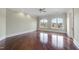Bright empty bedroom with hardwood floors, crown moulding, and windows with views of the neighborhood at 1404 Barony Lake Way, Raleigh, NC 27614