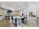 Gourmet kitchen featuring granite countertops, custom cabinets, island, and open floor plan at 1404 Barony Lake Way, Raleigh, NC 27614