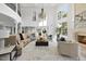 Spacious living room with high ceilings, a fireplace, and large windows providing natural light at 1404 Barony Lake Way, Raleigh, NC 27614