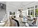 Cozy living room featuring a fireplace, TV, comfortable seating, and bright windows at 1404 Barony Lake Way, Raleigh, NC 27614