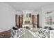 A luxurious living room with a fireplace, elegant seating, and wood floors for a comfortable space at 1404 Barony Lake Way, Raleigh, NC 27614