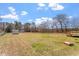 View of backyard featuring shed and deck at 1425 Country Pond Ln, Willow Springs, NC 27592
