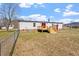 View of the backyard with a deck and a fence at 1425 Country Pond Ln, Willow Springs, NC 27592