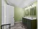 Spacious bathroom featuring a double vanity with well-lit mirrors at 1425 Country Pond Ln, Willow Springs, NC 27592