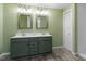 Bathroom with double sink vanity, and well-lit mirrors at 1425 Country Pond Ln, Willow Springs, NC 27592