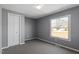 Bedroom with gray walls, carpet, a window and a closet at 1425 Country Pond Ln, Willow Springs, NC 27592