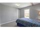 Bedroom with gray walls, carpet, and window letting in natural light at 1425 Country Pond Ln, Willow Springs, NC 27592
