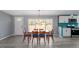Inviting dining room with a wooden table, seating six, and scenic outdoor views at 1425 Country Pond Ln, Willow Springs, NC 27592