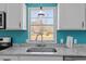 Modern kitchen sink with granite countertops, stainless steel appliances, and bright, natural light at 1425 Country Pond Ln, Willow Springs, NC 27592