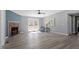 Bright and airy living room with a stone fireplace, french doors, and sleek flooring, perfect for modern living at 1425 Country Pond Ln, Willow Springs, NC 27592