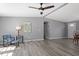 This open living area features a stylish color palette, comfortable seating, and modern flooring, creating a relaxing atmosphere at 1425 Country Pond Ln, Willow Springs, NC 27592